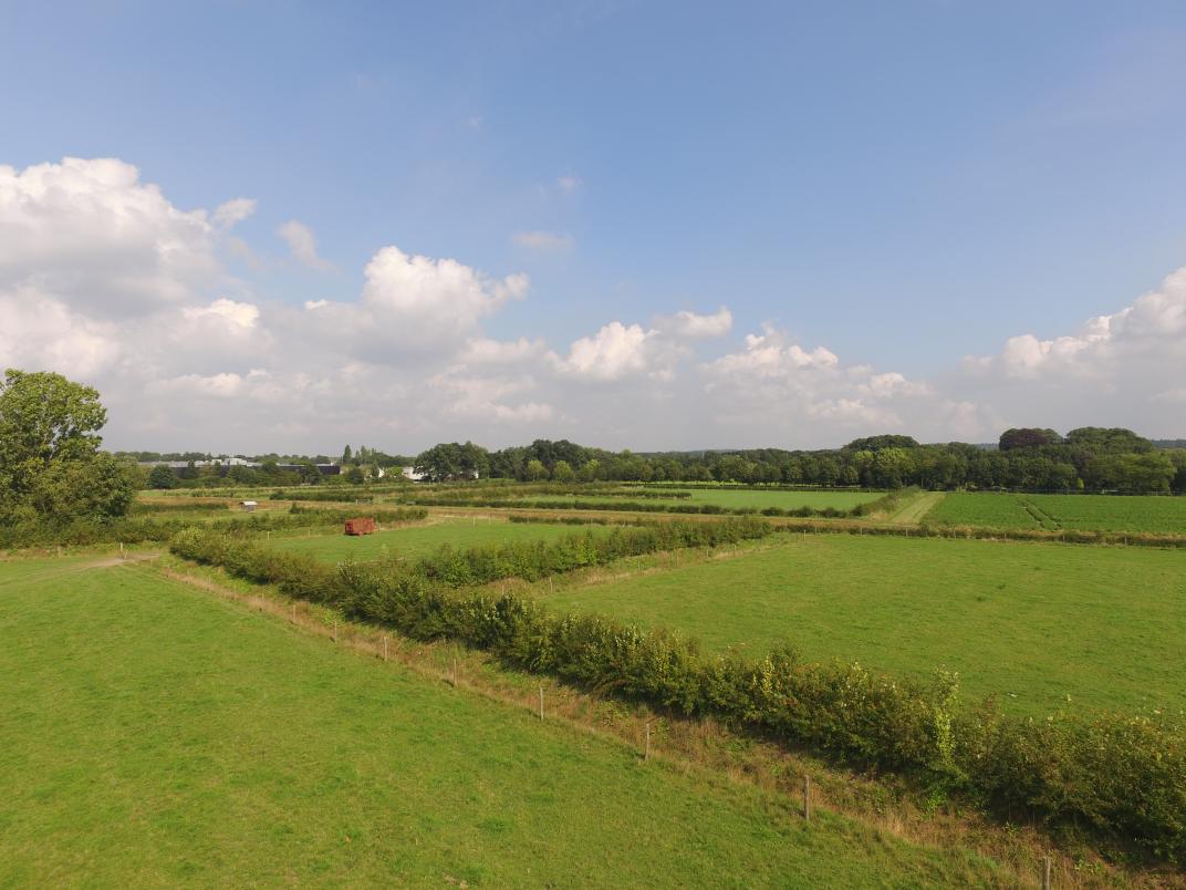 Een kleinschalig en groendooraderd landschap